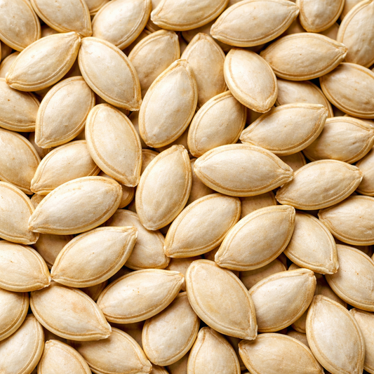 Close-up of a pile of light brown pumpkin seeds