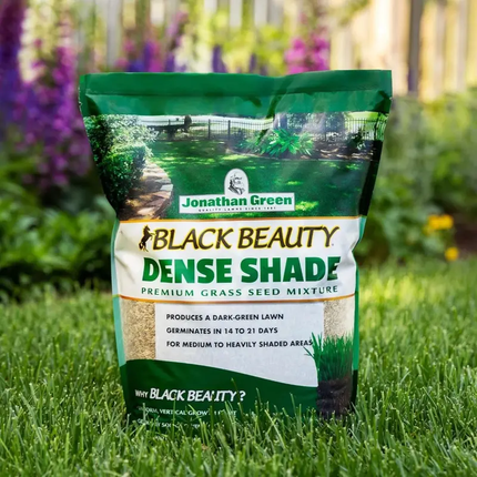 Jonathan Green Black Beauty Dense Shade premium grass seed mix bag on lush lawn. Seed World