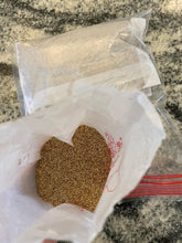 Close-up of emerald zoysia seeds in a small pack